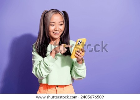 Photo of chinese blogger youngster girl select option in online using smartphone order pizza isolated over purple color background Royalty-Free Stock Photo #2405676509