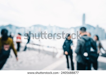 Blurred image of people enjoying the view of harbour hong kong
