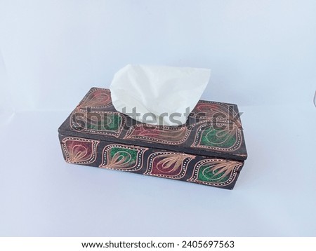 tissue box decorated with ethnic motifs on a white background