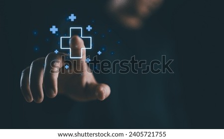 Businessman touching on virtual blue plus sign for positive thinking mindset or healthcare insurance symbol concept, Mental health care, mental rejuvenation. Royalty-Free Stock Photo #2405721755