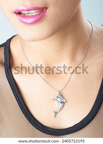 women dolphin  pendant silver necklace  Royalty-Free Stock Photo #2405722195