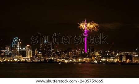 New Year's Eve Celebrations in Auckland, New Year, New Zealand 2023. Cityscape at night with Sky Tower over the water.  Royalty-Free Stock Photo #2405759665