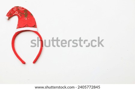 cute Christmas headbands with christmas 
red santa claus hat isolate on a white backdrop. concept of joyful Christmas party,New year is coming soon, festive season decoration with Christmas elements