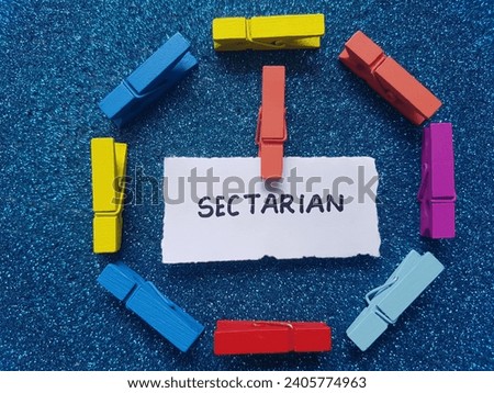 Sectarian writing on blue background. Royalty-Free Stock Photo #2405774963