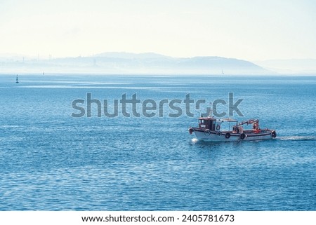 A vessel sails on the Atlantic Ocean coast, Galicia, Spain