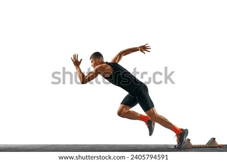 Side view full length portrait of young sportsman, professional runner runs up quickly against white background. Concept of sport, active lifestyle, action. Ad. Copy space for text. Royalty-Free Stock Photo #2405794591