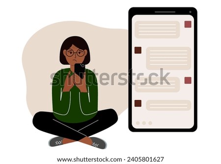 A woman sits and holds a phone. The correspondence is visible on the screen. Concept of chat, sms, service, technical support. Royalty-Free Stock Photo #2405801627