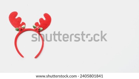 cute christmas headbands with funny red deer horns isolate on a white backdrop. concept of joyful christmas party,new year is coming soon, festive season decoration with christmas elements
