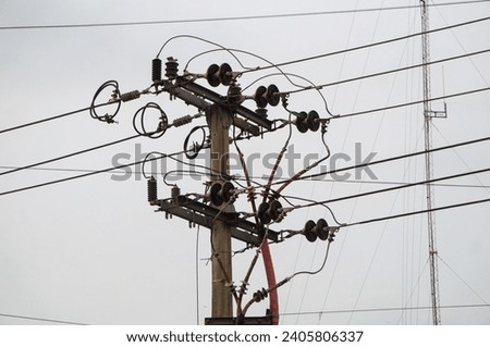 Electric pole with power cables with sky background in morning