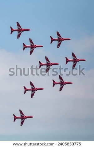 Red arrow RAF display team on the English coastline