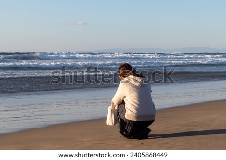 Maenohama beach and woman in Tanegashima Island, Kagoshima in Japan
