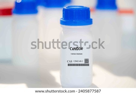 CaAl2O4 calcium aluminate CAS 12042-68-1 chemical substance in white plastic laboratory packaging Royalty-Free Stock Photo #2405877587