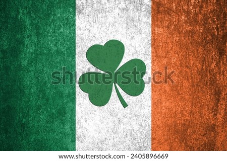 St. Patrick's Day background. Shamrocks against the background of the Irish flag. Decoration for St. Patrick's Day. Banner design