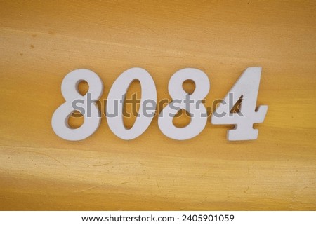 The golden yellow painted wood panel for the background, number 8084, is made from white painted wood.
