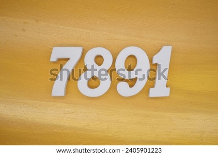 The golden yellow painted wood panel for the background, number 7891, is made from white painted wood.
