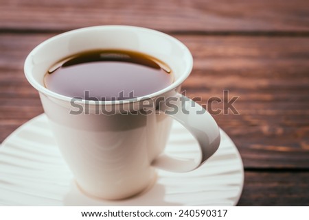 Coffee cup on wooden table in coffee shop cafe - Vintage effect style pictures