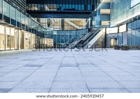 Empty square floor and city glass building landscape Royalty-Free Stock Photo #2405920457