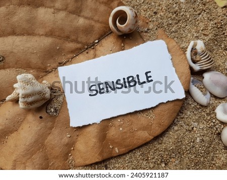 Sensible writing on beach sand background.