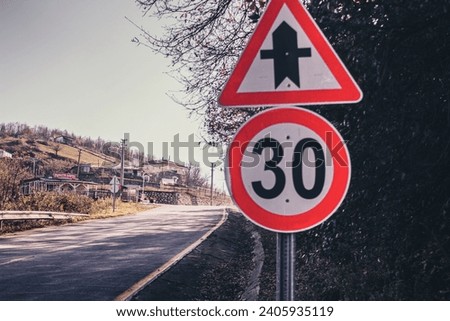 speed limit sign, main road secondary road junction sign, asphal, mountain road, road to the village, autumn time,