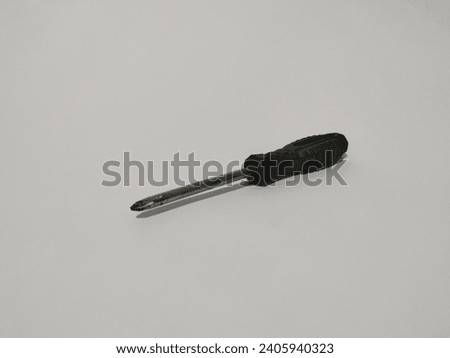black screwdriver located diagonally isolated on white background