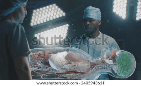Diverse surgeons work in operating room. African American doctor talks with colleague, uses virtual holographic display with 3D graphics of human skeleton and organs. AR in medicine. Advanced surgery.