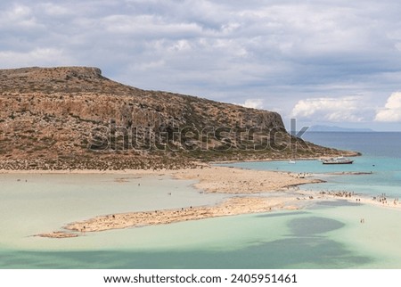A picture of the blue water of Balos Beach and the nearby landscape of the Gramvousa Peninsula.