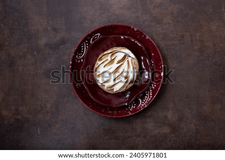Delicious Lemon meringue pie on rustic background