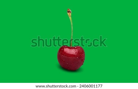 Single cherry on green screen 