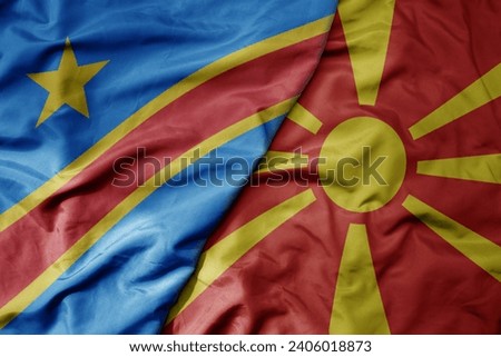 big waving national colorful flag of macedonia and national flag of democratic republic of the congo . macro