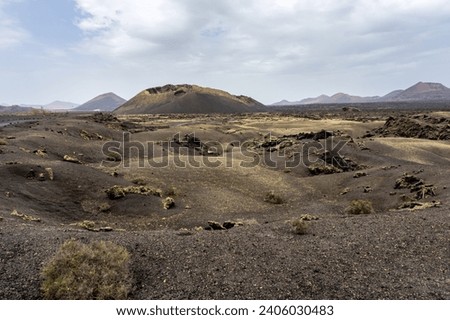 Los Cuervos Volcano, a caldera that can be visited in a barren area dotted with rocks during a sunny day