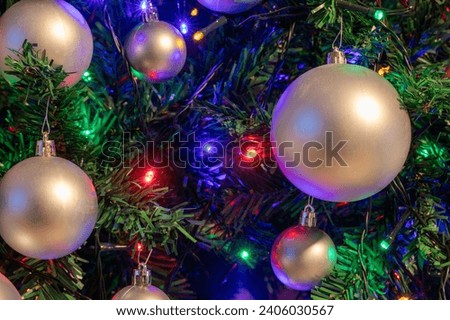 Artificial Christmas Tree with Ornaments and Lights - Holiday Background and Texture
