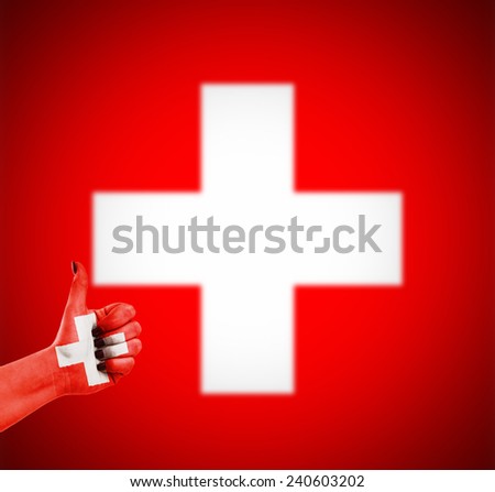 Flag of Switzerland on human hand