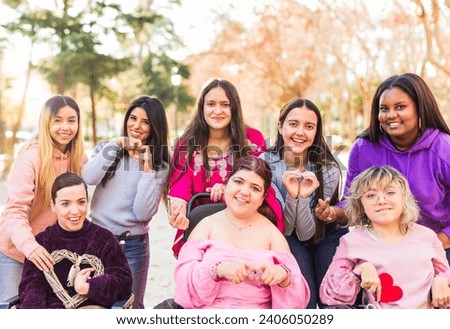 InspireInclusion international womens day. Multiethnic group do heart love hand gesture. Disability Royalty-Free Stock Photo #2406050289