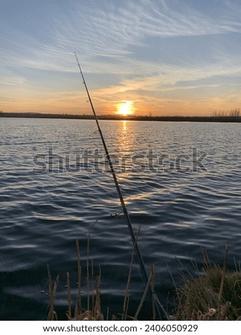 fishing in the rays of the setting sun