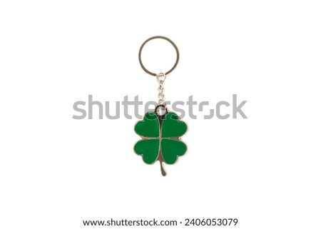 Clover keychain with key ring isolated on white background. Concepts for real estate and moving home or renting property. Buying a property. Mock-up keychain.Copy space.