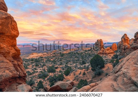 View of the valley from the North Window Arch at sunset. Arches National Park. Utah. USA