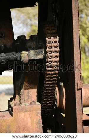A street Photograph of Rusty Farm Machinery at the Peghorn Nature Park and Trail taken on December27,2023. This image shows the discarded and broken down machines from long ago. 