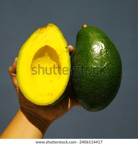 Super Rare Huge Avocado with beautiful colors Royalty-Free Stock Photo #2406114417