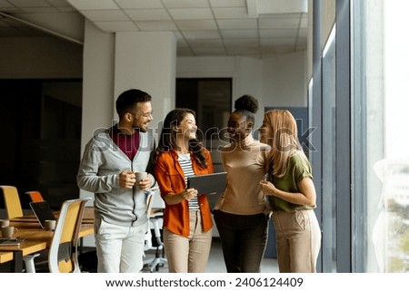 Young multiethnic startup team working at the modern office Royalty-Free Stock Photo #2406124409