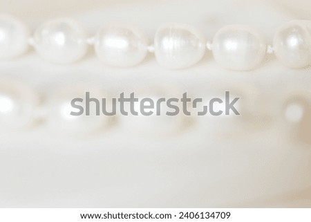 Closeup Delicate Soft Background of White Pearl Necklace With Copy Space