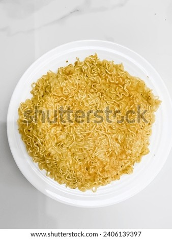 Fried egg mixed with Indomie "martabak noodles"