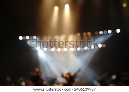 Defocused entertainment concert lighting on stage, blurred disco party and Concert Live. Royalty-Free Stock Photo #2406139987