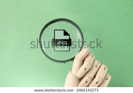 magnifier is looking for a jpeg file. the concept of file management. jpeg or jpg format