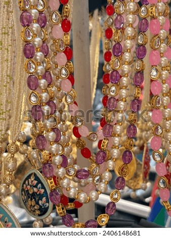 Golden pearl retail fake jewllery displayed