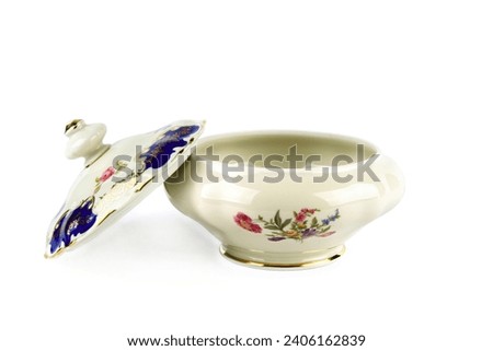 Porcelain box for sweets isolated on a white background. German vintage porcelain, Winterling porcelain manufactory. Royalty-Free Stock Photo #2406162839