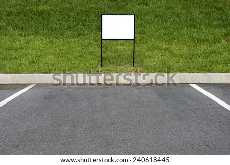 Horizontal Shot Of A Blank Sign In Front Of Parking Place