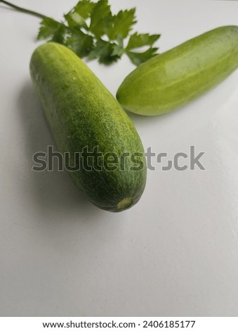 This is a photo of cucumbers on a white background