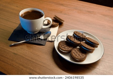 Enjoying life with fresh hot black Italian coffee and baked pastry. Self-care morning ritual. Time off in cafe. Enjoy specialty coffee. Top view of americano in white mug, spoon, napkin, cookies. Cup.
