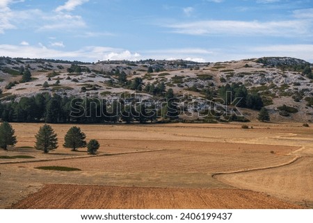 Plowed fields at the foot of the Sierra de Albarracin mountains, Spain