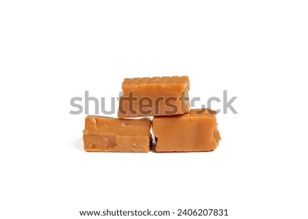Delicious Caramel Candy Stacked like Bricks on White Background – Sweet Indulgence Royalty-Free Stock Photo #2406207831